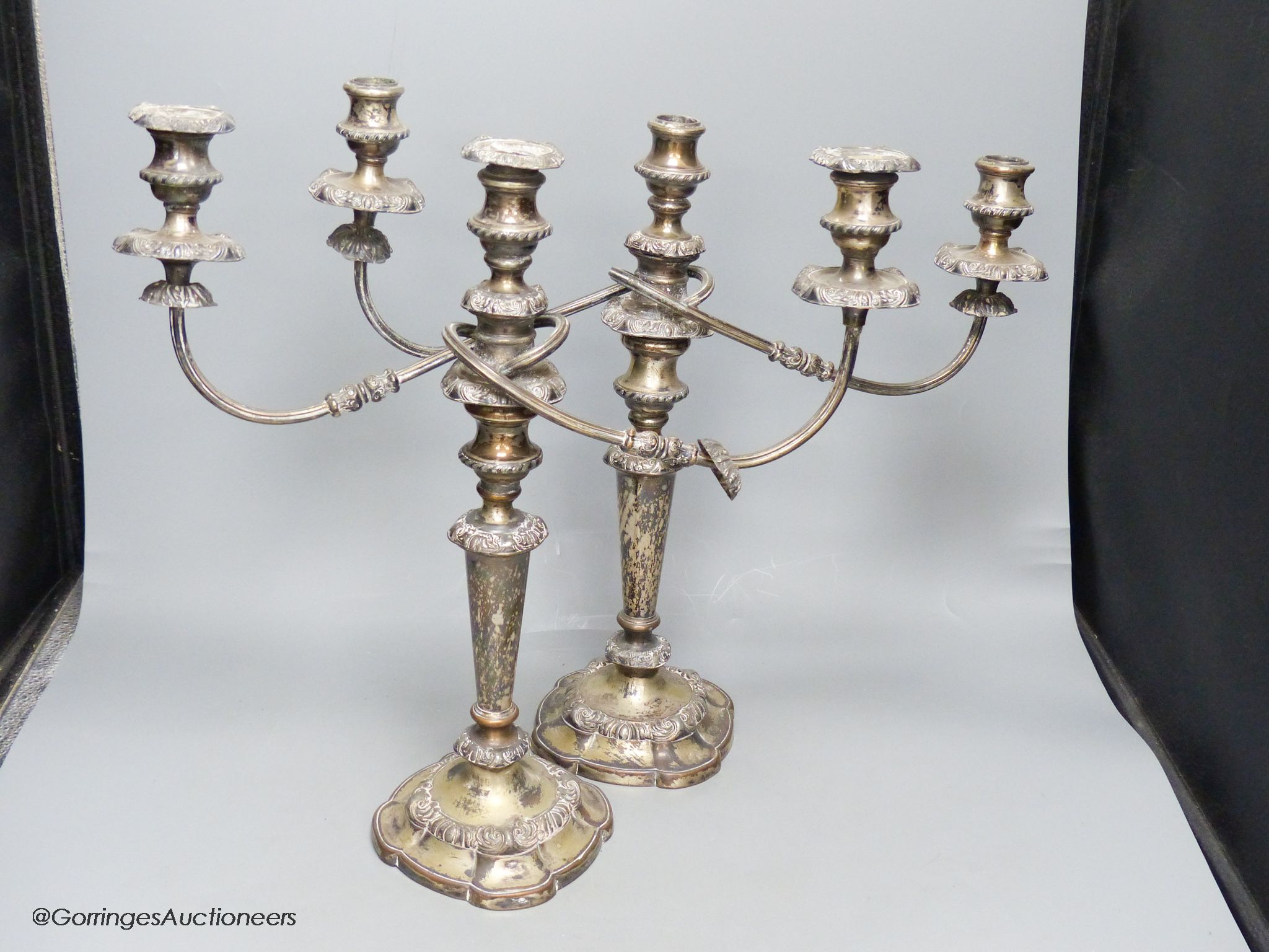 A pair of silver plated two branch three light candelabra, height 40cm
